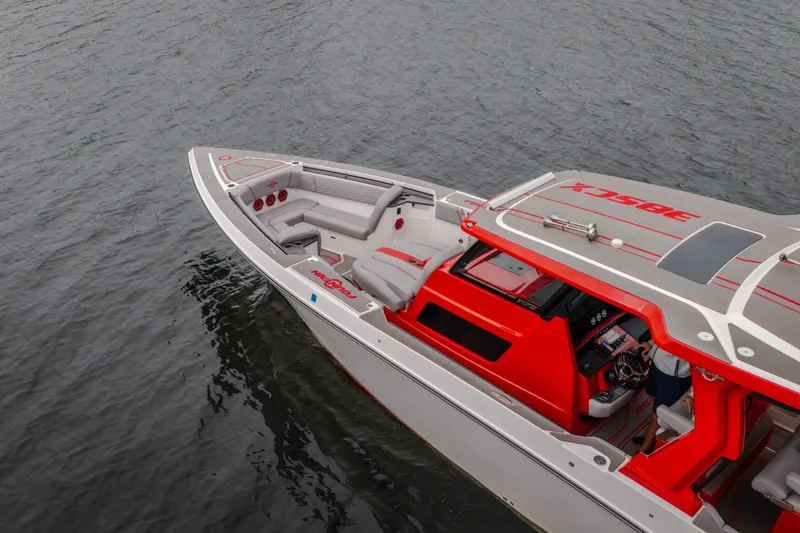 Slide: The Image of 2024 Fountain 38 SCX boat with sleek design on calm water. - 4