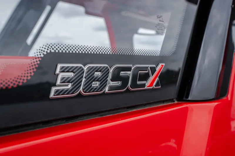 Slide: The Image of 2024 Fountain 38 SCX logo on red boat exterior. - 59