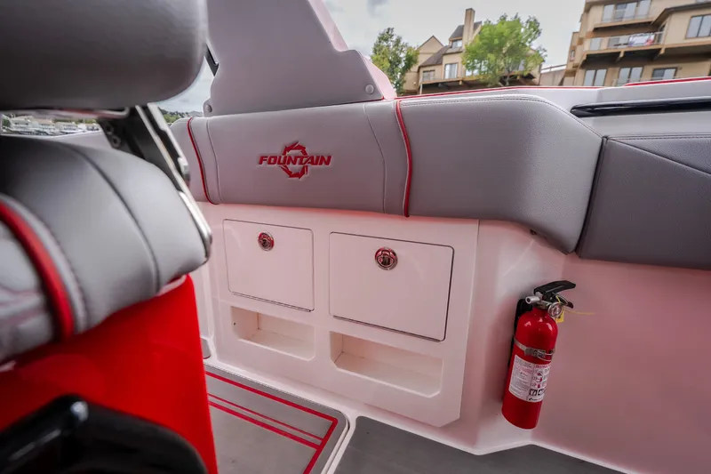 Slide: The Image of 2024 Fountain 38 SCX boat interior with storage compartments and fire extinguisher. - 17