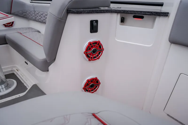 Slide: The Image of Interior of 2024 Fountain 38 SCX boat with red speakers and gray seating. - 73