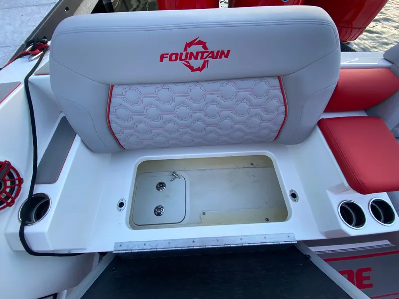 Slide: The Image of 2024 Fountain 38 SCX boat seat with storage compartment and cup holders. - 24