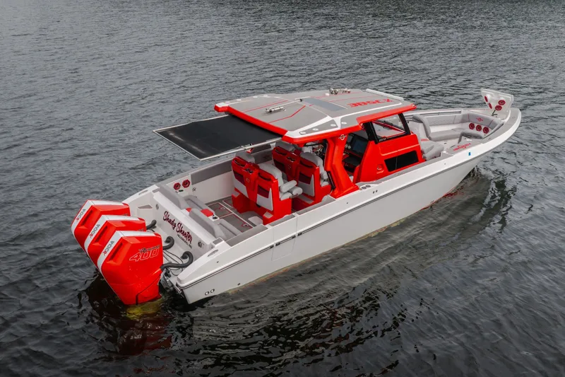 Slide: The Image of 2024 Fountain 38 SCX boat with triple outboard engines on calm water. - 13