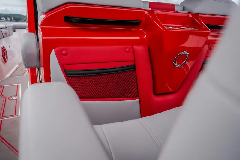 Slide: The Image of 2024 Fountain 38 SCX boat interior with red and gray seating and stylish design. - 32