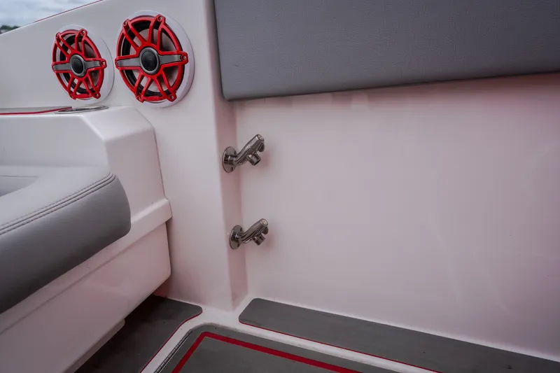Slide: The Image of 2024 Fountain 38 SCX boat interior with red speakers and gray seating. - 24