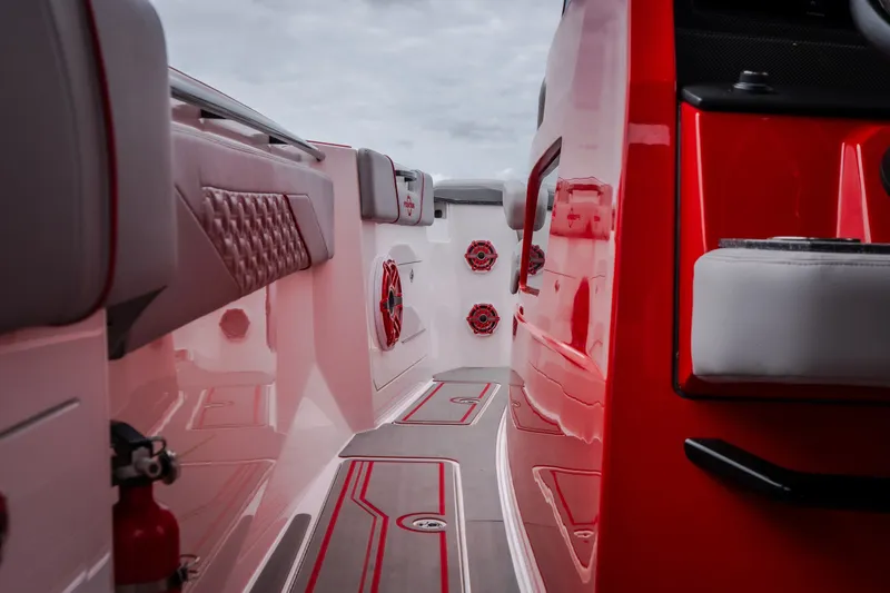 Slide: The Image of 2024 Fountain 38 SCX boat interior with red accents and modern design features. - 33