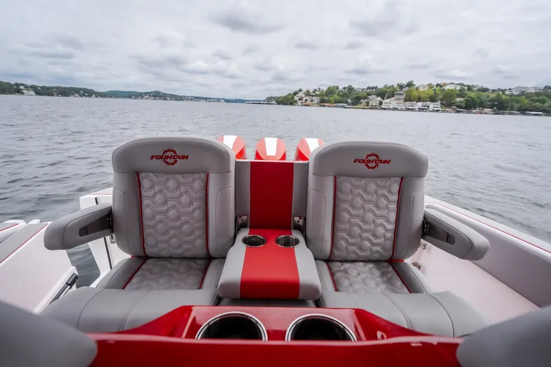 Slide: The Image of 2024 Fountain 38 SCX boat interior with stylish seating on a lake. - 46