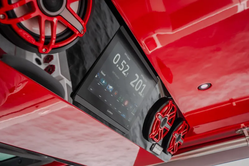 Slide: The Image of Red interior of 2024 Fountain 38 SCX boat with speakers and digital display. - 41