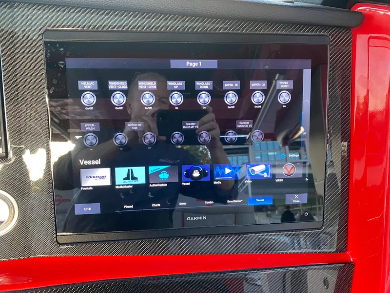 Slide: The Image of 2024 Fountain 38 SCX touchscreen control panel with various vessel settings and options. - 27