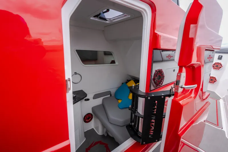 Slide: The Image of 2024 Fountain 38 SCX boat cabin with red exterior and modern interior design. - 51