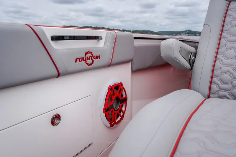 Slide: The Image of 2024 Fountain 38 SCX boat interior with red accents and speaker detail. - 78