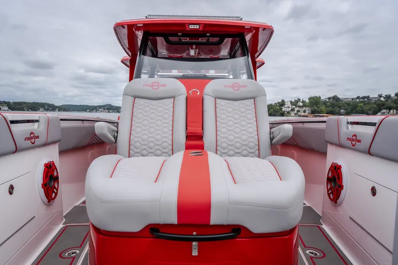 Slide: The Image of 2024 Fountain 38 SCX boat interior with red and white seating, showcasing luxury design. - 77