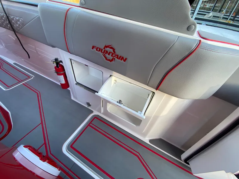 Slide: The Image of 2024 Fountain 38 SCX boat interior with storage compartment and fire extinguisher. - 21