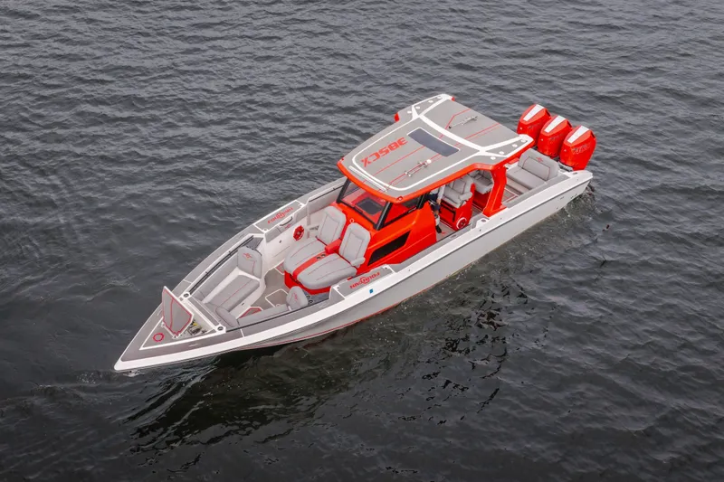 Slide: The Image of 2024 Fountain 38 SCX boat with red accents on water, showcasing sleek design and triple engines. - 11