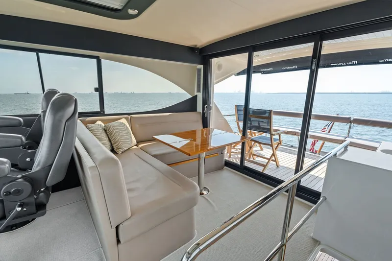 Slide: The Image of Luxurious interior of 2016 Maritimo M58 yacht with ocean view and seating area. - 26