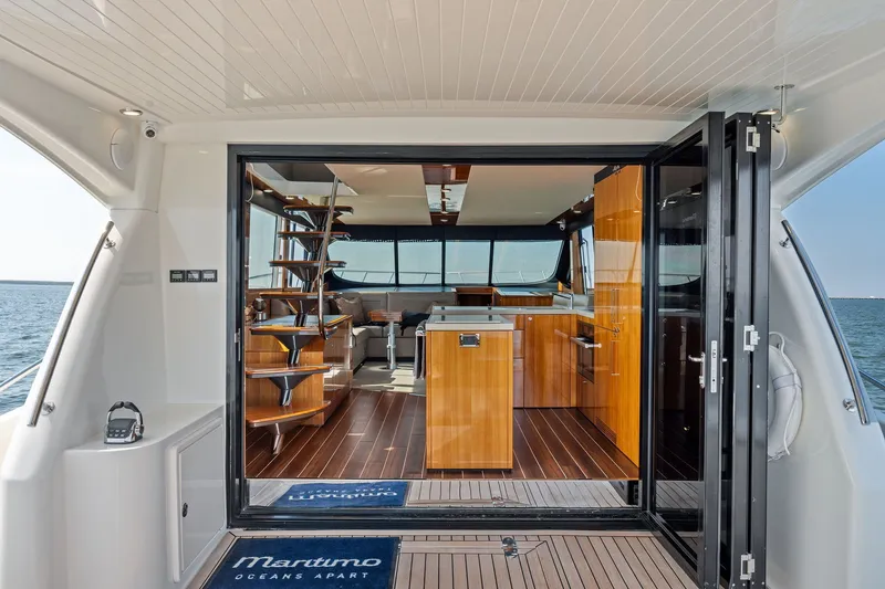 Slide: The Image of Luxurious interior of 2016 Maritimo M58 yacht with modern wood finishes and ocean view. - 20