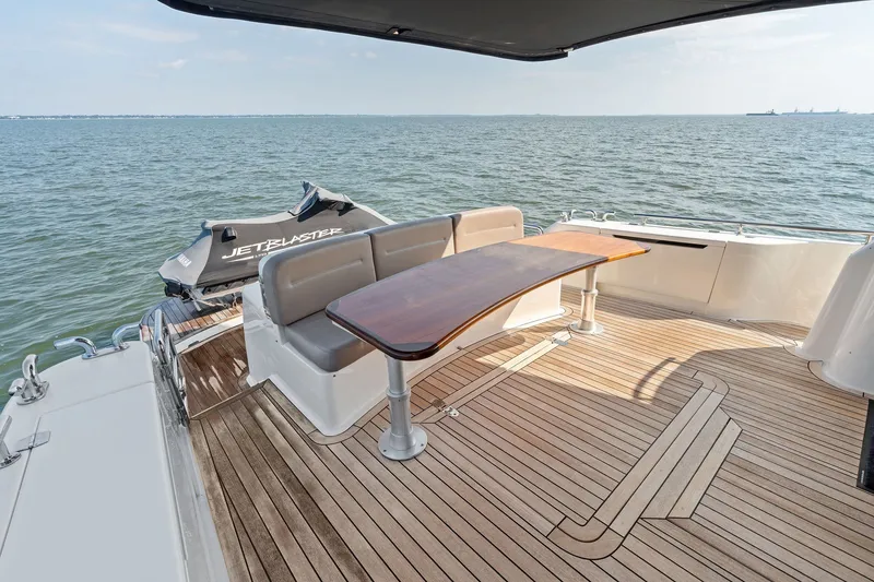 Slide: The Image of Luxury 2016 Maritimo M58 yacht deck with seating and JetBlaster jet ski. - 7