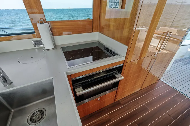 Slide: The Image of Luxurious kitchen interior of 2016 Maritimo M58 yacht with ocean view. - 36
