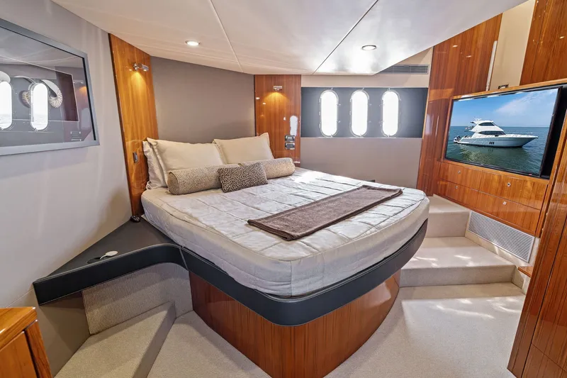 Slide: The Image of Luxurious bedroom interior of 2016 Maritimo M58 yacht with elegant wood finishes. - 42