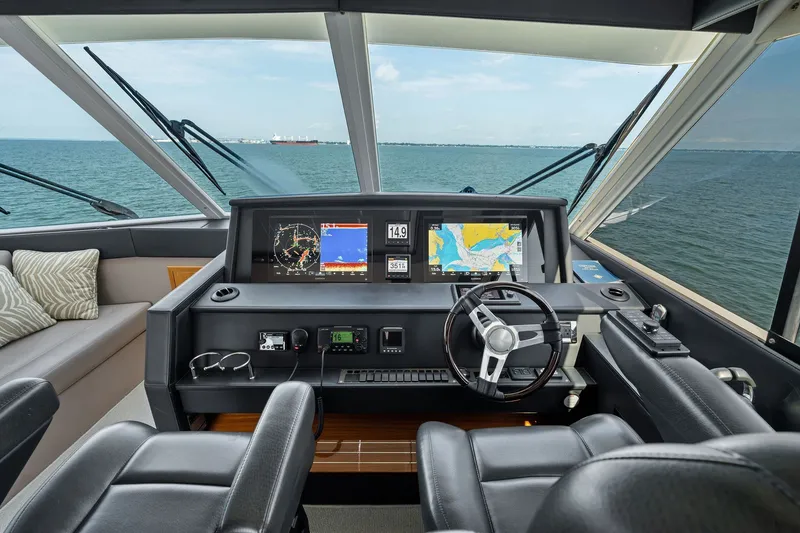 Slide: The Image of Helm of 2016 Maritimo M58 yacht with navigation screens and steering wheel. - 23