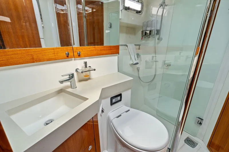 Slide: The Image of Luxurious bathroom in 2016 Maritimo M58 yacht with modern fixtures and glass shower. - 49