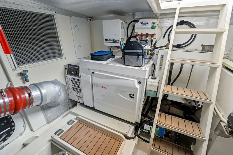 Slide: The Image of Engine room of 2016 Maritimo M58 yacht with Cummins Onan generator and equipment. - 58