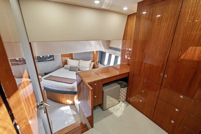 Slide: The Image of Luxurious cabin interior of 2016 Maritimo M58 yacht with wood finishes and cozy bed. - 39
