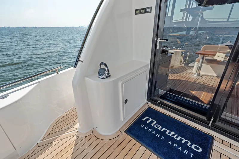 Slide: The Image of 2016 Maritimo M58 yacht deck with ocean view and elegant interior. - 11