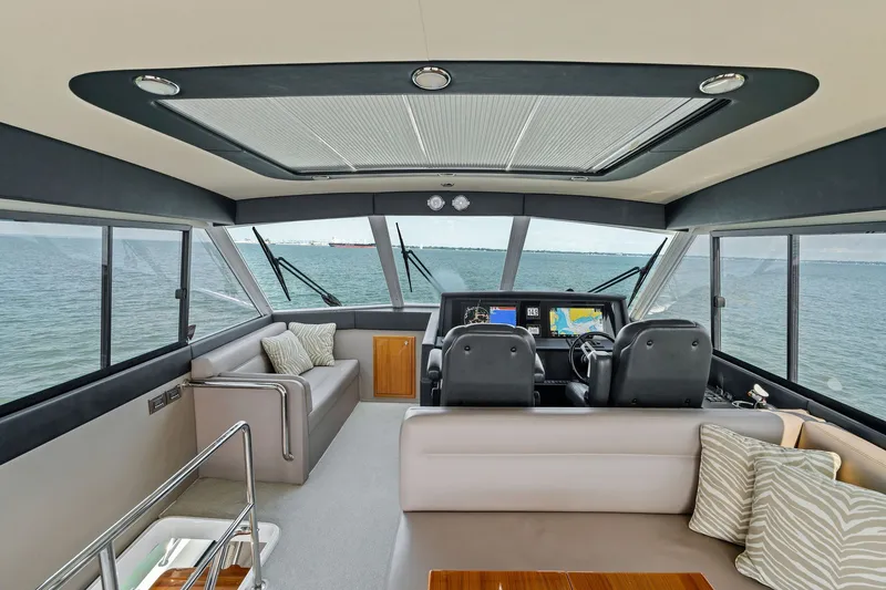 Slide: The Image of Luxurious interior of 2016 Maritimo M58 yacht with ocean view and modern helm. - 21