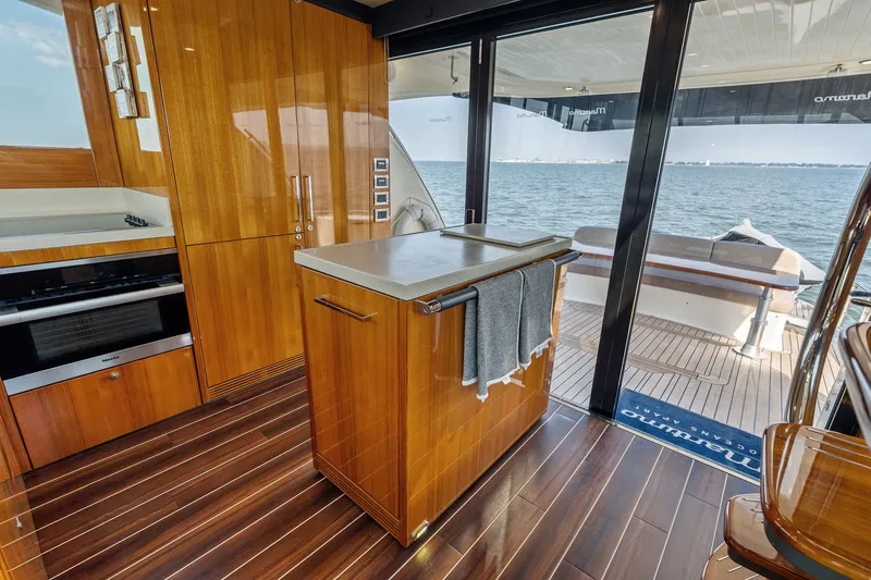 Slide: The Image of Luxurious 2016 Maritimo M58 yacht interior with modern kitchen and ocean view. - 29