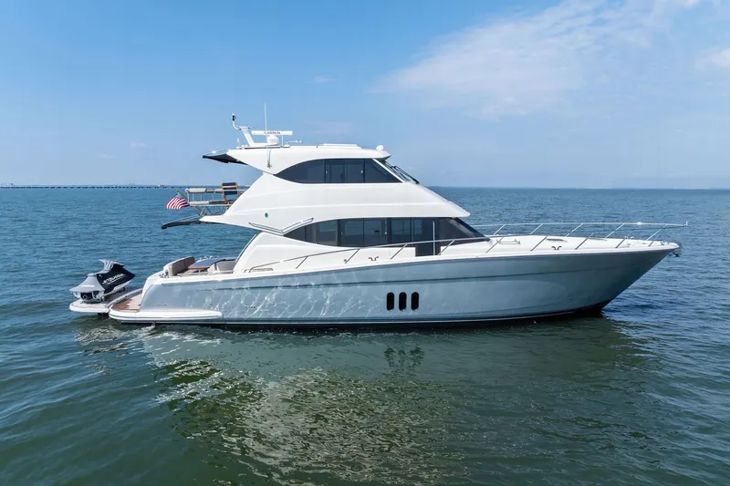 The Image of 2016 Maritimo M58 yacht on calm ocean waters, side view. - 0