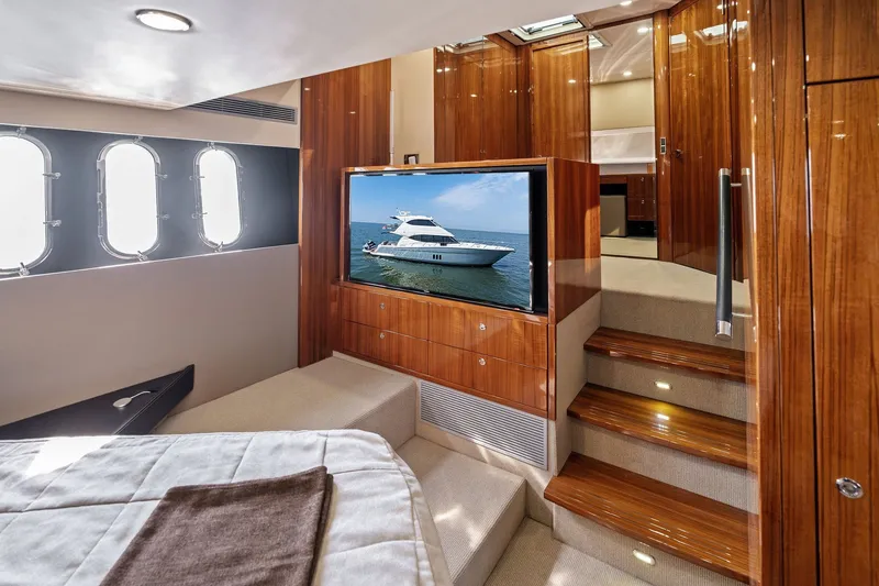 Slide: The Image of Luxurious interior of 2016 Maritimo M58 yacht with wood finishes and a flat-screen TV. - 43