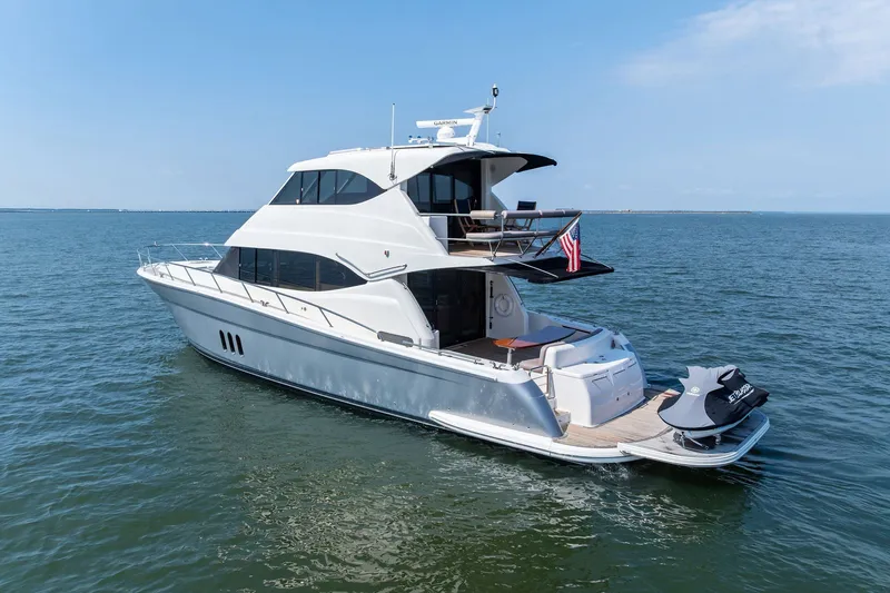 Slide: The Image of 2016 Maritimo M58 yacht on open water, featuring sleek design and luxury amenities. - 4