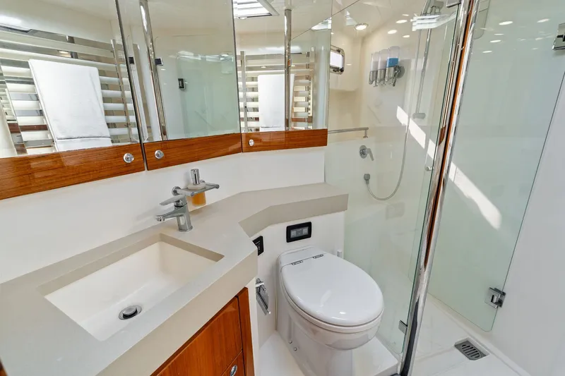 Slide: The Image of Luxurious 2016 Maritimo M58 yacht bathroom with modern fixtures and glass shower. - 44