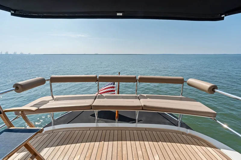 Slide: The Image of Rear deck view of 2016 Maritimo M58 yacht with ocean backdrop. - 19
