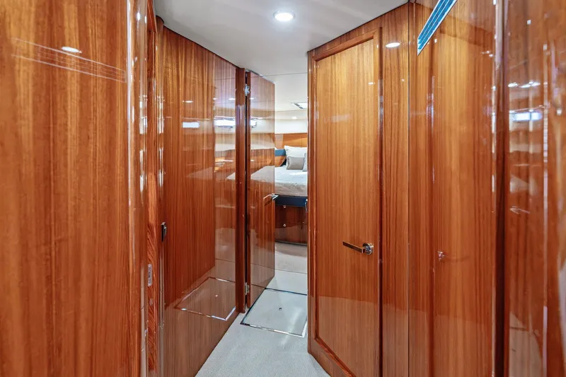 Slide: The Image of Luxurious wooden interior of 2016 Maritimo M58 yacht hallway leading to bedroom. - 38