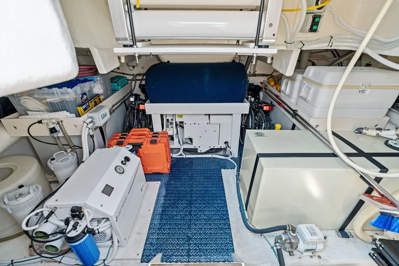 Slide: The Image of Engine room of a 2016 Maritimo M58 yacht, showcasing equipment and storage. - 55