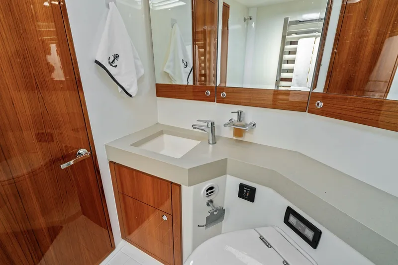 Slide: The Image of Luxurious bathroom in 2016 Maritimo M58 yacht with modern fixtures and wooden cabinetry. - 45