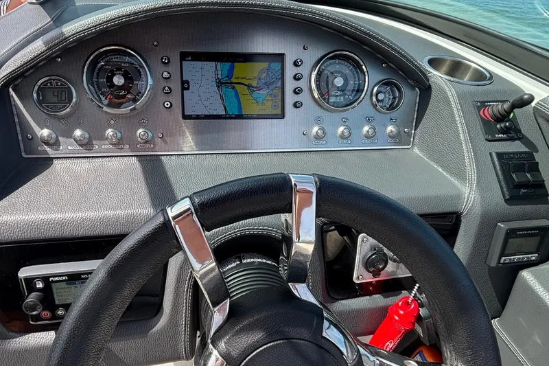 Slide: The Image of Dashboard of a 2017 Regal 2800 Bowrider boat with navigation display and controls. - 6