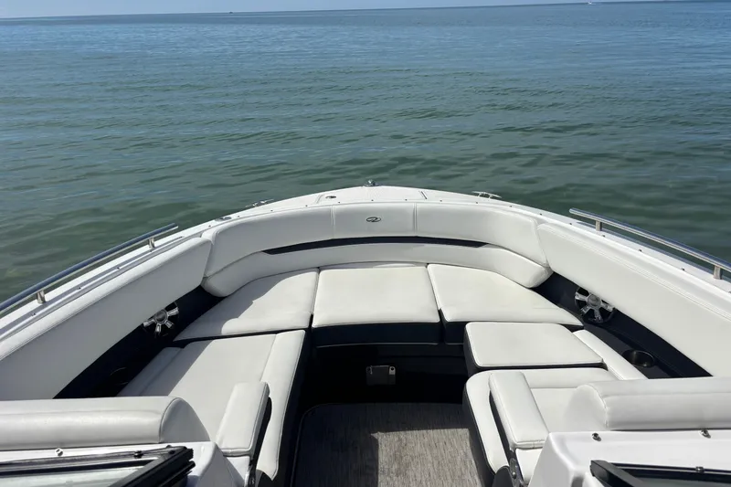 Slide: The Image of 2017 Regal 2800 Bowrider with spacious seating on calm water. - 9