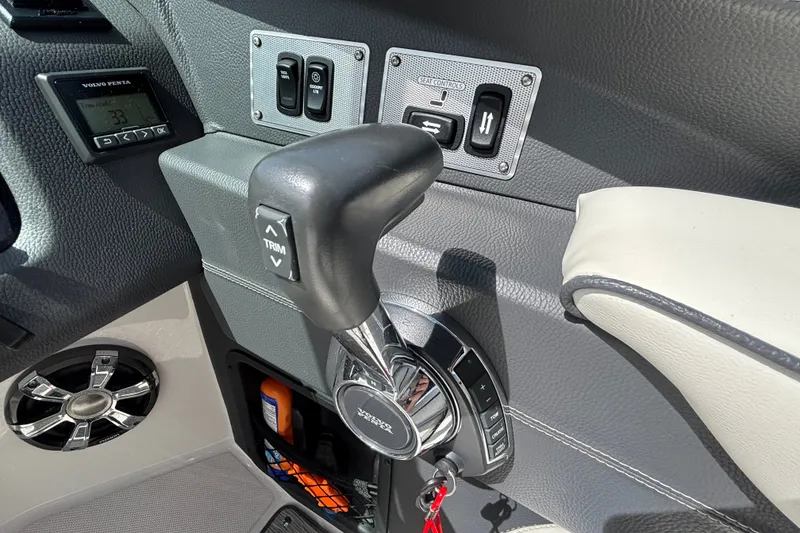 Slide: The Image of Control panel of a 2017 Regal 2800 Bowrider boat with trim and seat controls. - 19
