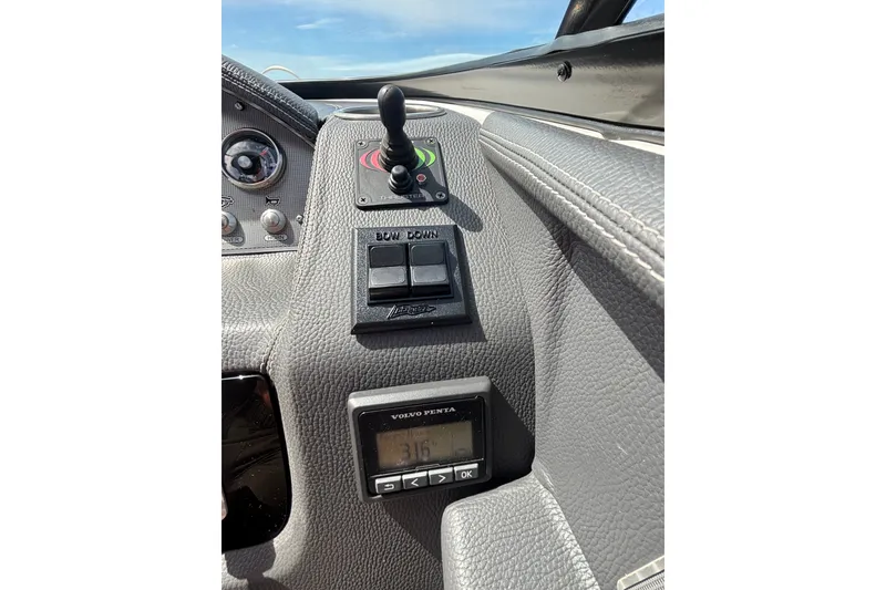 Slide: The Image of Control panel of a 2017 Regal 2800 Bowrider boat with joystick and display. - 5