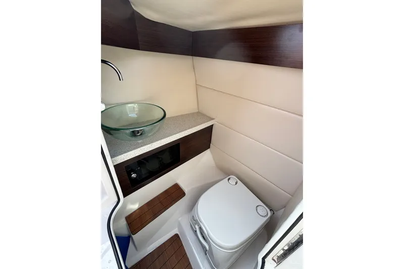 Slide: The Image of 2017 Regal 2800 Bowrider boat interior with modern sink and toilet. - 17