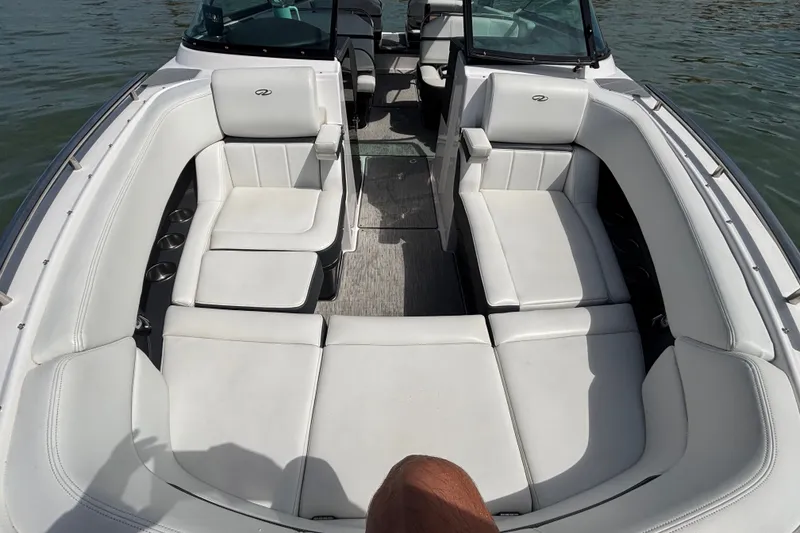Slide: The Image of 2017 Regal 2800 Bowrider boat interior with white seating and open layout. - 11
