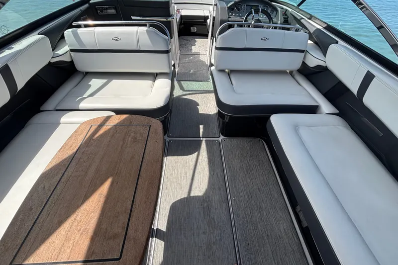 Slide: The Image of 2017 Regal 2800 Bowrider interior with spacious seating and elegant wood accents. - 14
