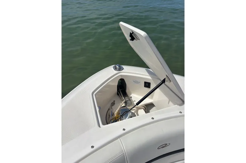 Slide: The Image of Open storage compartment on 2017 Regal 2800 Bowrider boat, showing anchor and equipment. - 7