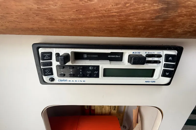 Slide: The Image of Clarion Marine radio system in a 1999 Pursuit 2460 Denali boat dashboard. - 30