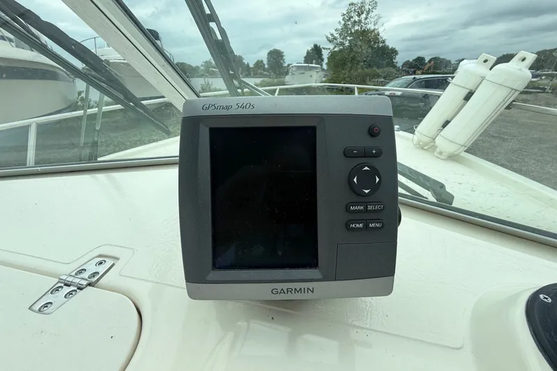 Slide: The Image of Garmin GPSmap 540s on 1999 Pursuit 2460 Denali boat dashboard, with windshield view. - 13