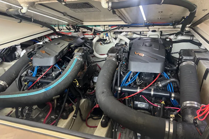 Slide: The Image of Engine compartment of a 2000 Pursuit 3000 Express boat with dual V8 engines. - 25