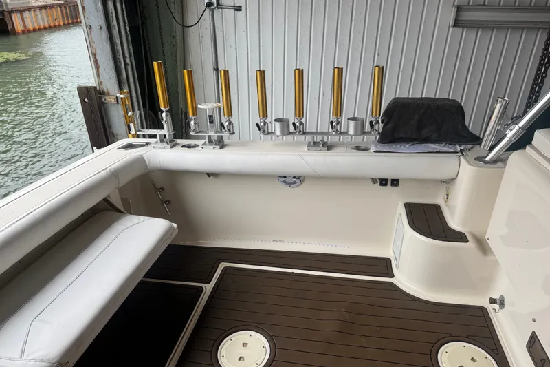 Slide: The Image of Interior of a 2000 Pursuit 3000 Express boat with fishing rod holders. - 15