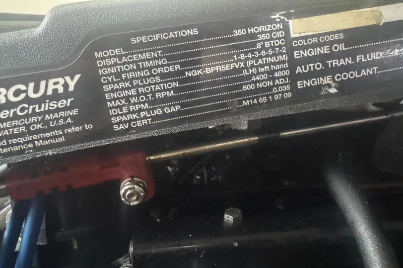 Slide: The Image of Engine specifications label on a 2000 Pursuit 3000 Express boat. - 33